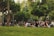 Community members gathering in a neighborhood park discussing local initiatives.