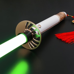A close-up of hands holding a glowing sword against a dark background.