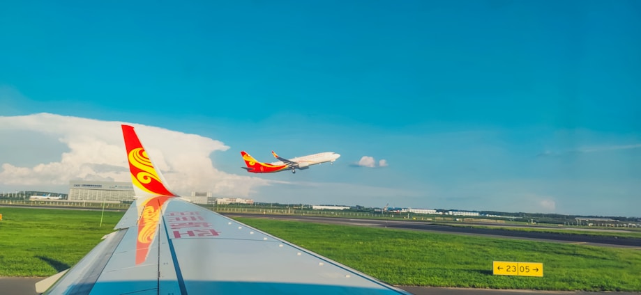 A sleek Ethiopian Airlines airplane taking off against a clear blue sky.
