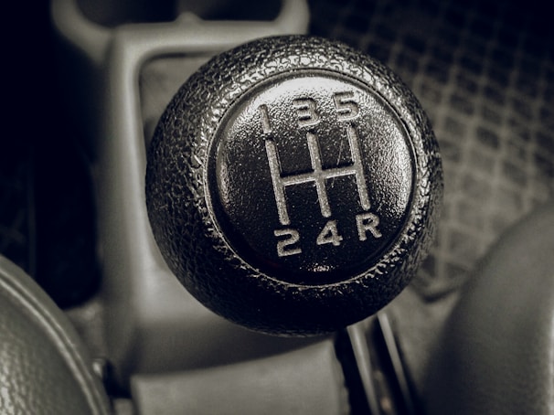 Detailed view of a Hilux gear shift knob with textured grip.