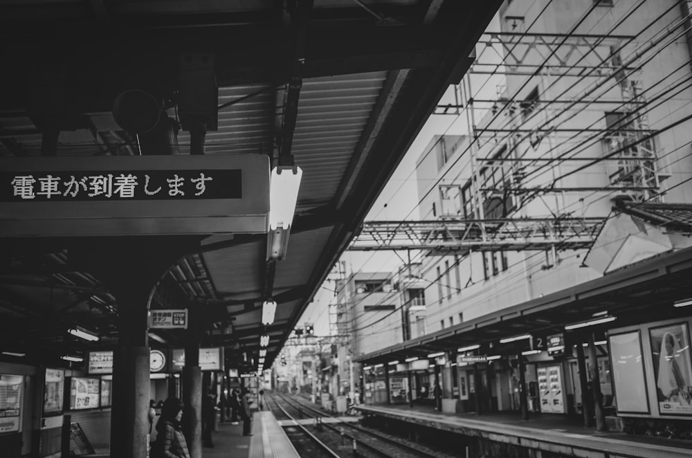 a black and white photo of a train station