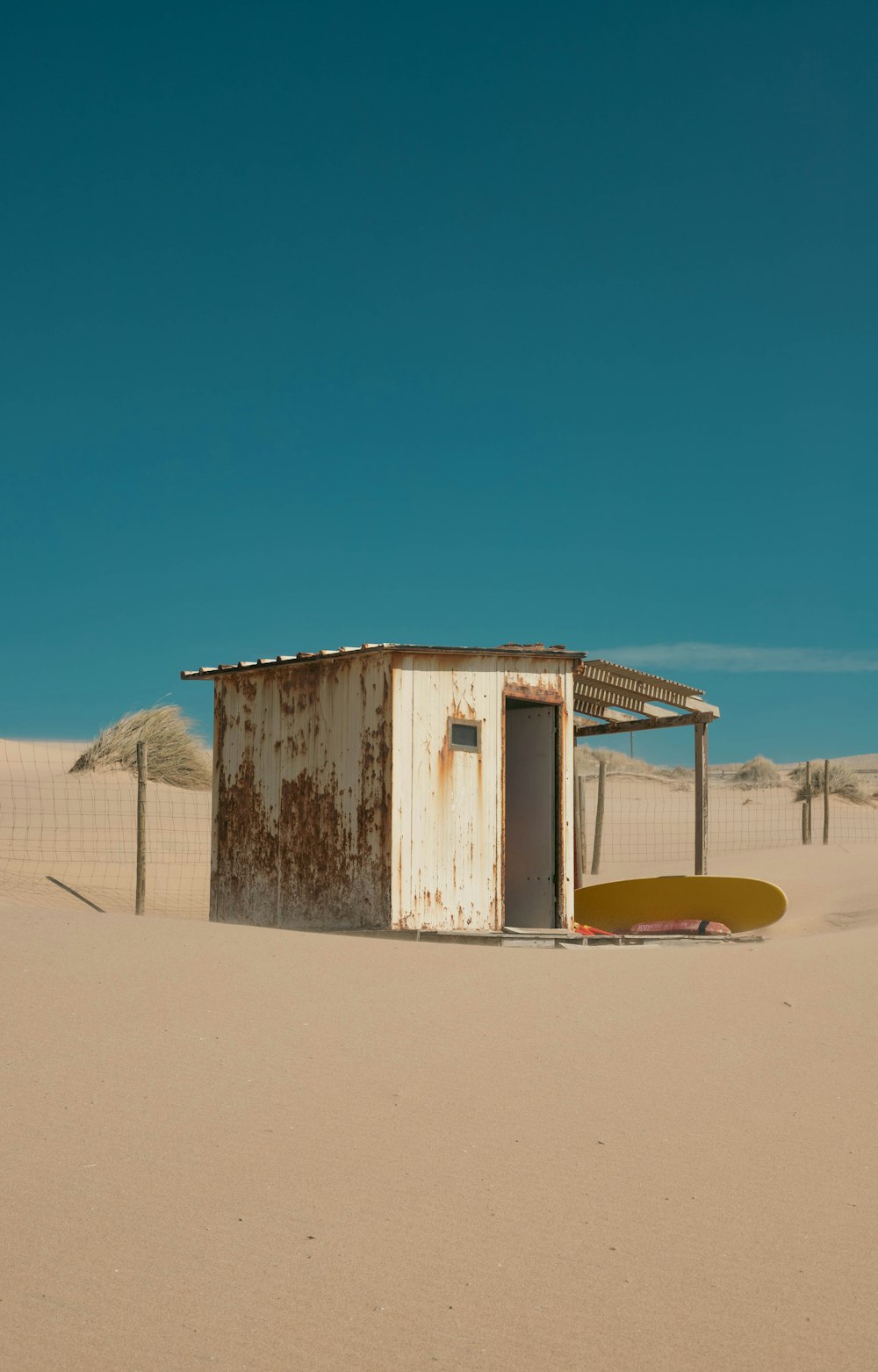 an outhouse in the middle of the desert