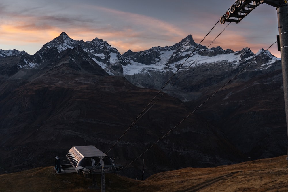 a ski lift with a small house on top of it