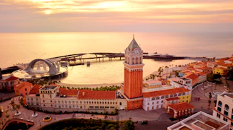 an aerial view of a city with a clock tower
