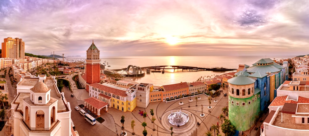 an aerial view of a city with a large body of water