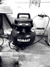 Technician performing maintenance on an air compressor.