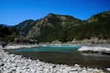 The crystal-clear waters of Sonmarg river flowing through golden alpine meadows.