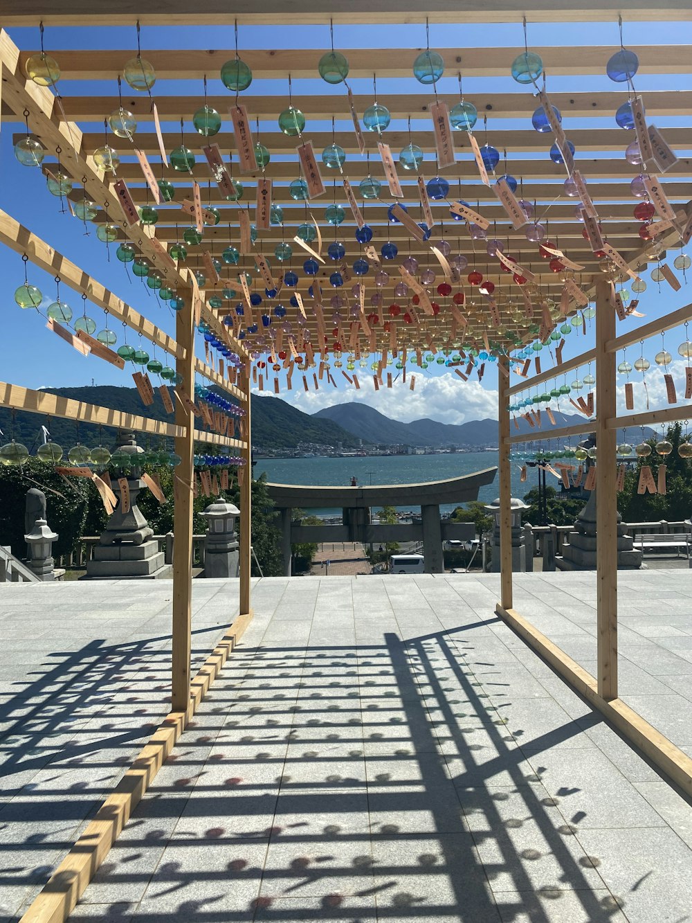 a wooden structure with glass balls hanging from it