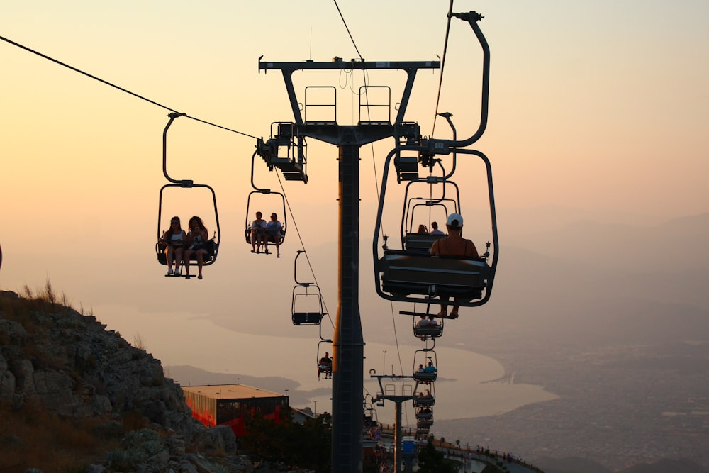 a group of people riding a ski lift