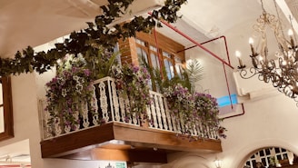 A cozy balcony area overlooking the wedding hall, set up for guests to relax.