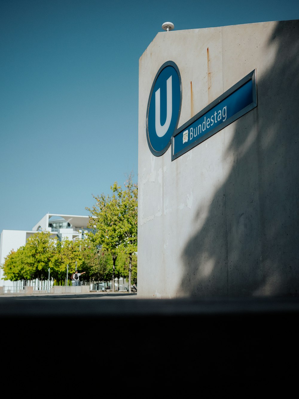 a building with a blue u sign on the side of it