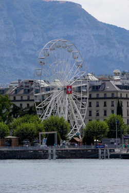 a ferris wheel sitting in front of a large building