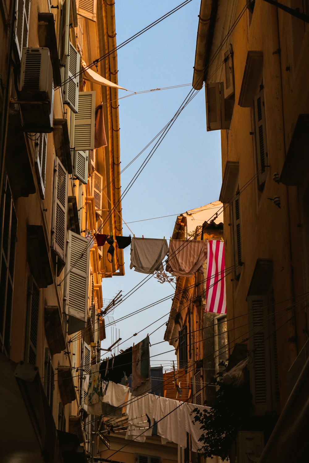 a city street with clothes hanging from a line