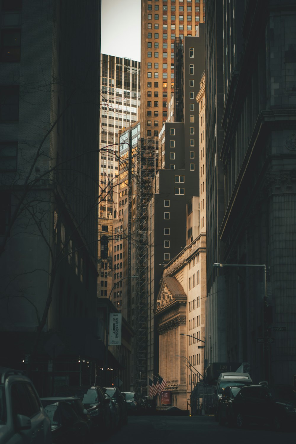 a city street with tall buildings in the background