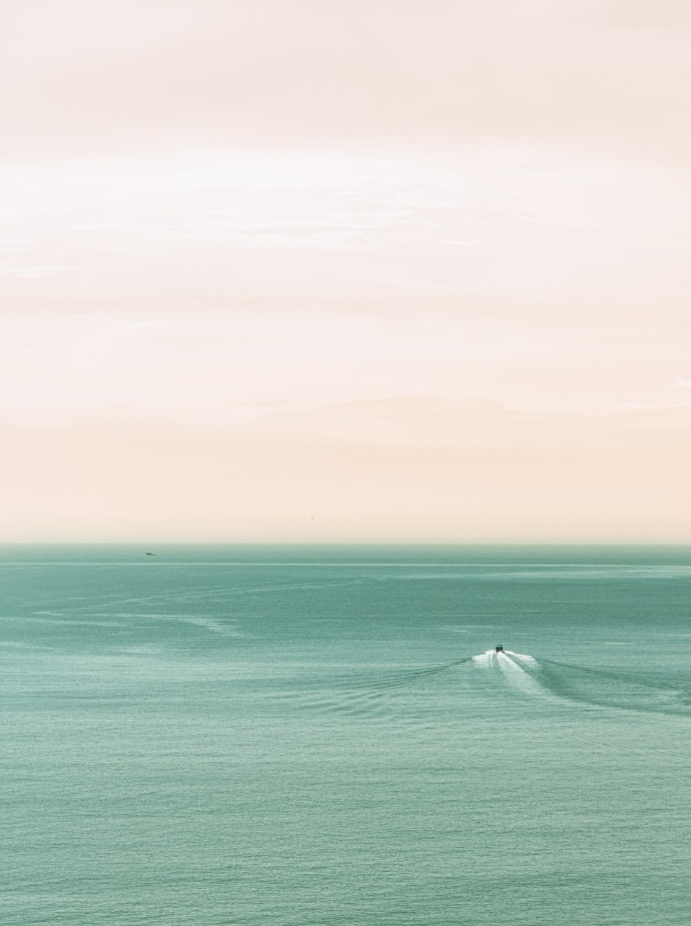 a person riding a surfboard on a wave in the ocean