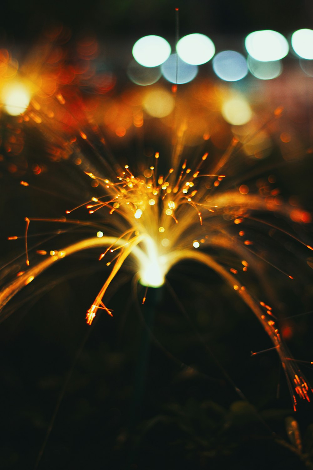 a close up of a sparkler in the dark