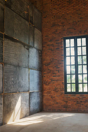 Bright tutoring space with whiteboard filled with algebraic equations.