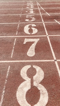 Close-up of a high-quality running track surface with lane markings.