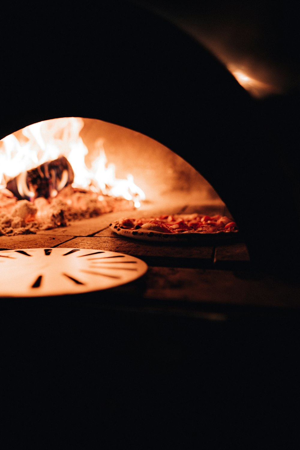 a close up of a pizza in an oven
