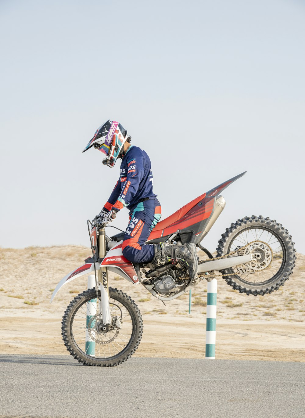 a person riding a dirt bike on a track