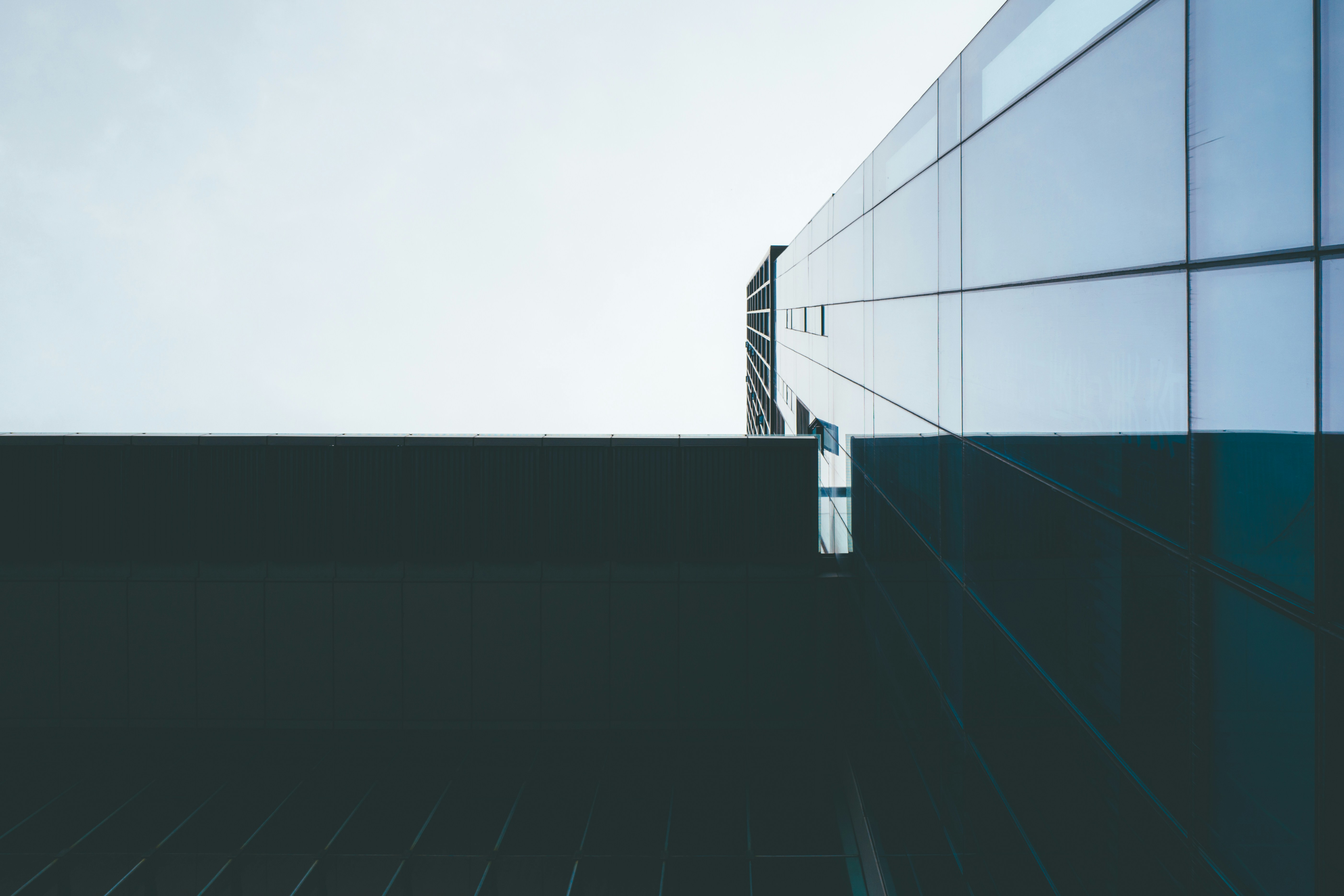 a tall building with a sky in the background