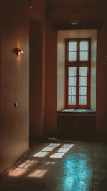 Warm beige and turquoise therapy space with calming natural light.