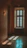 A serene therapy room with soft blue walls and natural light streaming in.
