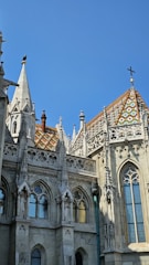 The grand interior of the Matthias Church with colorful tiled roof.