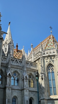 The grand interior of the Matthias Church with colorful tiled roof.