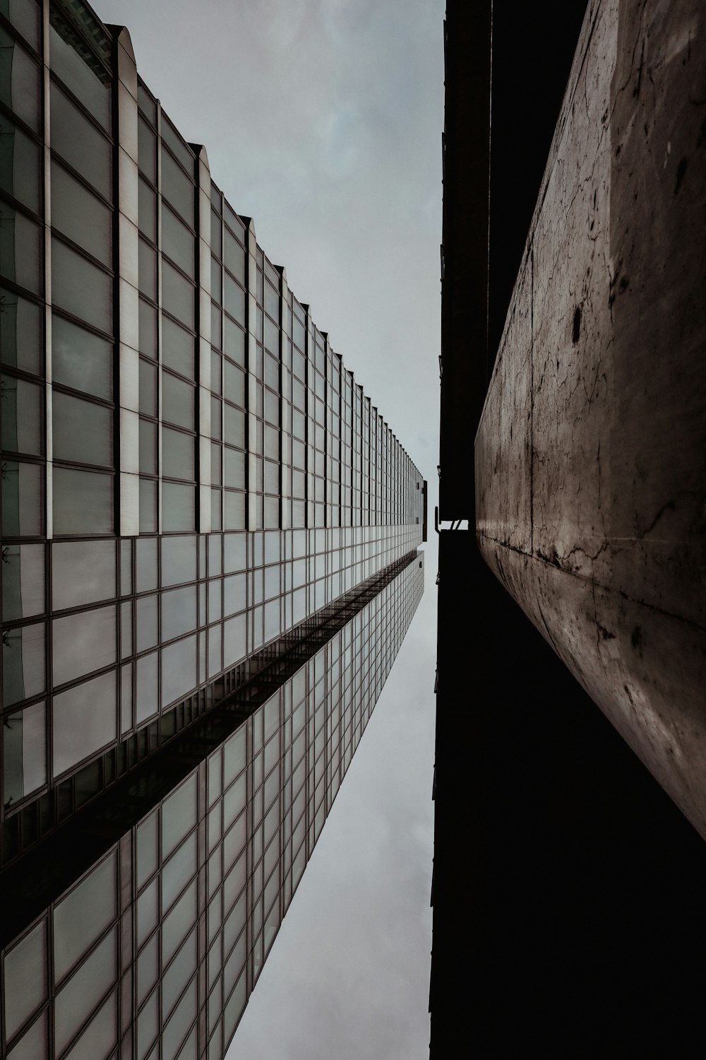 a tall building next to a body of water