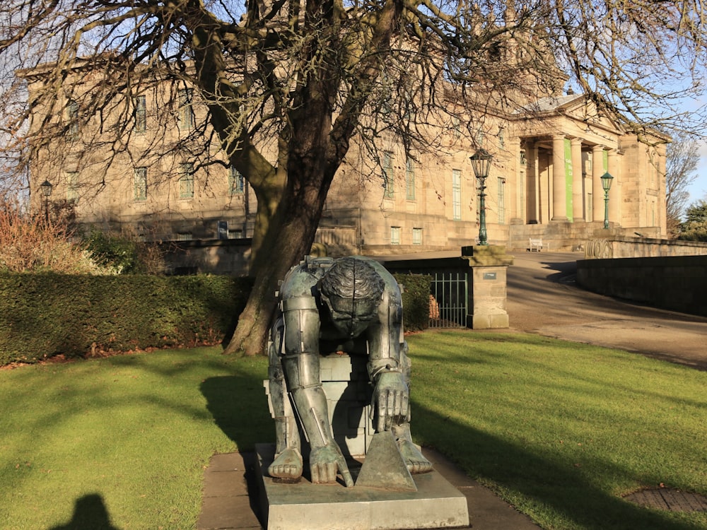 a statue of a horse in front of a building