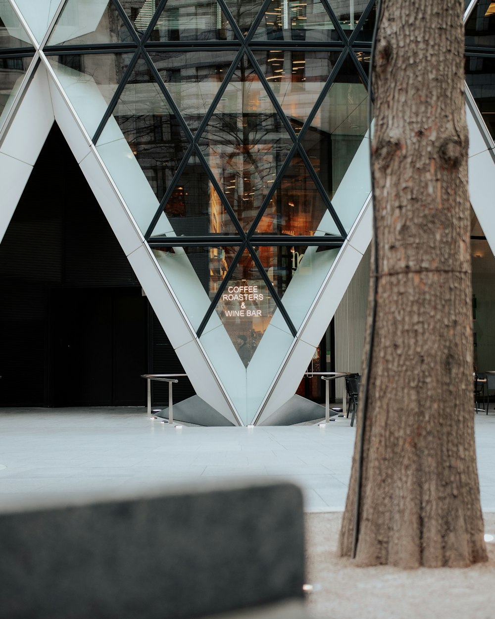 a building that has a tree in front of it