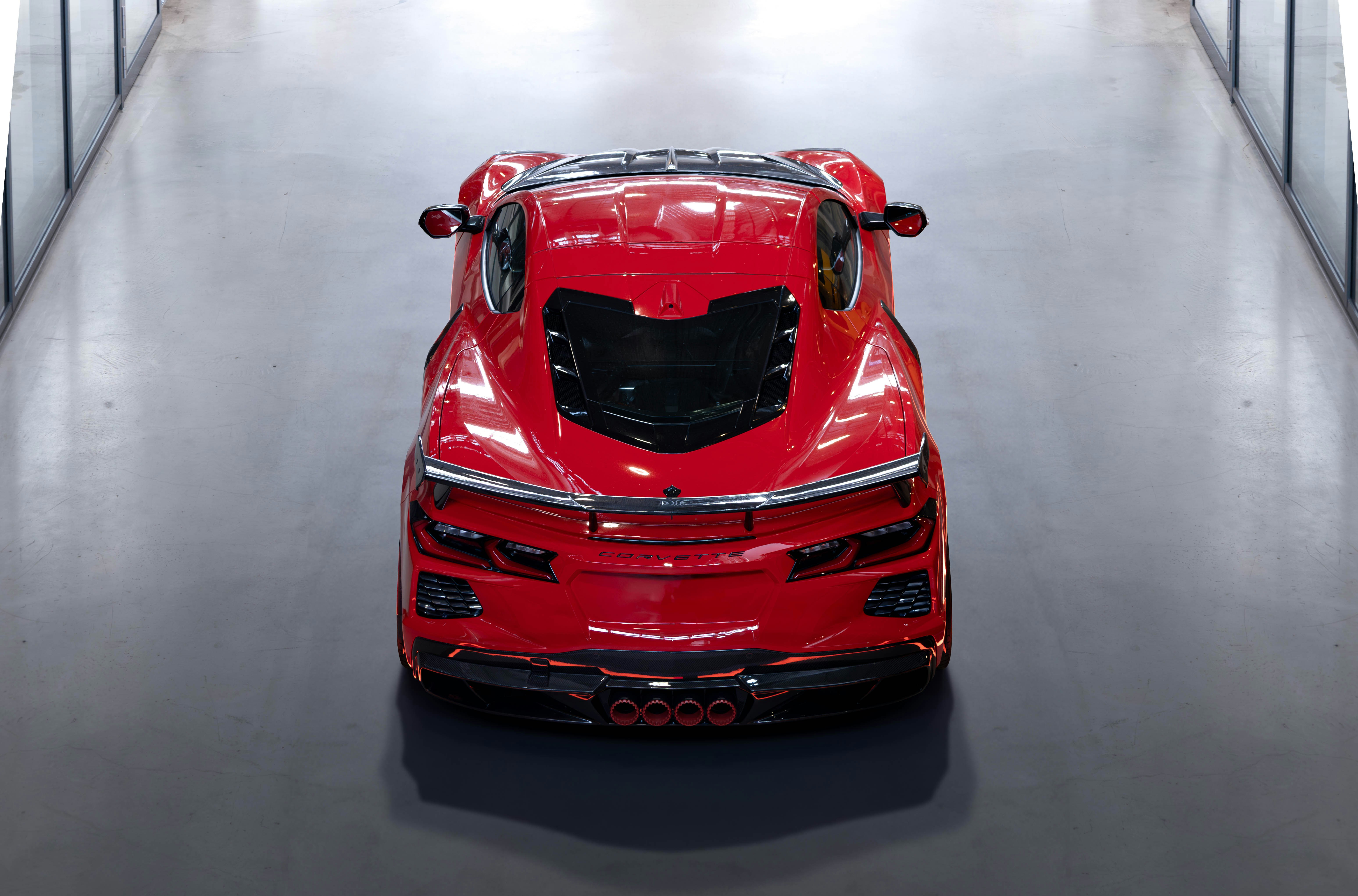 a red sports car parked in a garage