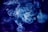Swirling clouds of smoke create an intricate and ethereal pattern against a dark background. The smoke is primarily in shades of blue and white, forming wispy, translucent shapes that seem to dance through the air.