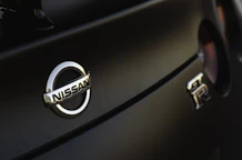 a close up of a nissan emblem on a car