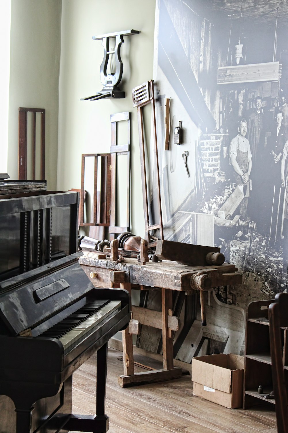 a room filled with lots of furniture and a piano