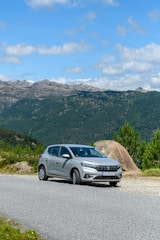 a silver car parked on the side of a road