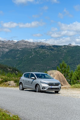 a silver car parked on the side of a road