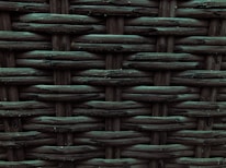 A close-up view of a woven pattern with a textured, grid-like structure. The material appears to be a dark, possibly synthetic fiber that crisscrosses to form a rigid surface. Each strand has a slightly glossy finish, adding depth and dimension to the pattern.