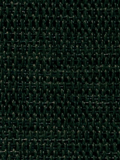 A close-up view of a woven fabric texture featuring a dense, interlocking pattern of dark green fibers. The intricate and repetitive design creates a tactile, three-dimensional effect.