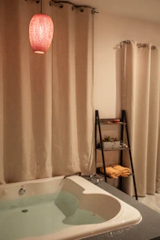 A cozy, updated bathroom featuring sleek fixtures and soft lighting.