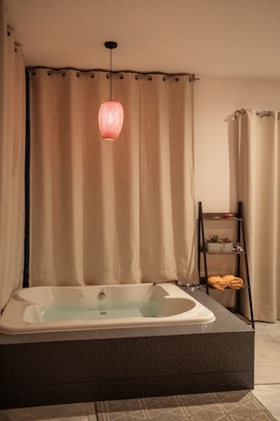 A cozy bathroom with warm lighting and elegant decor.