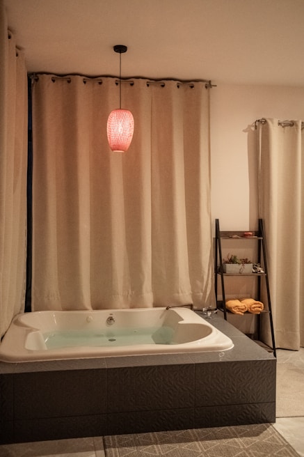 Cozy bathroom transformation with warm wooden cabinets and soft ambient lighting.