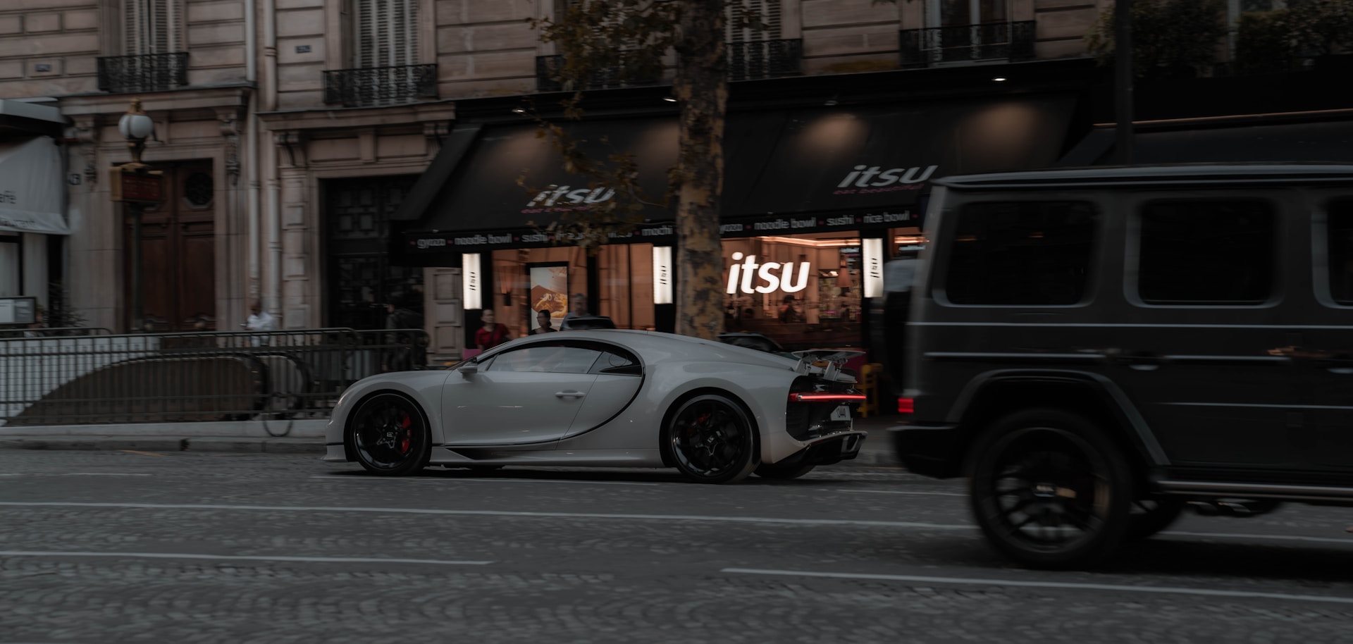 a bugatti is parked on the side of the road