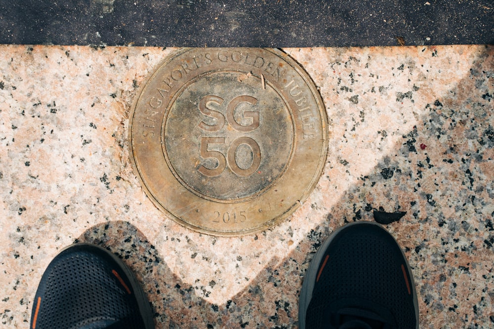 a close up of a person standing on a sidewalk