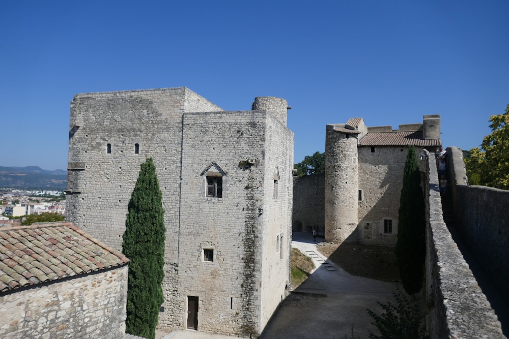 an old castle with a walkway leading to it