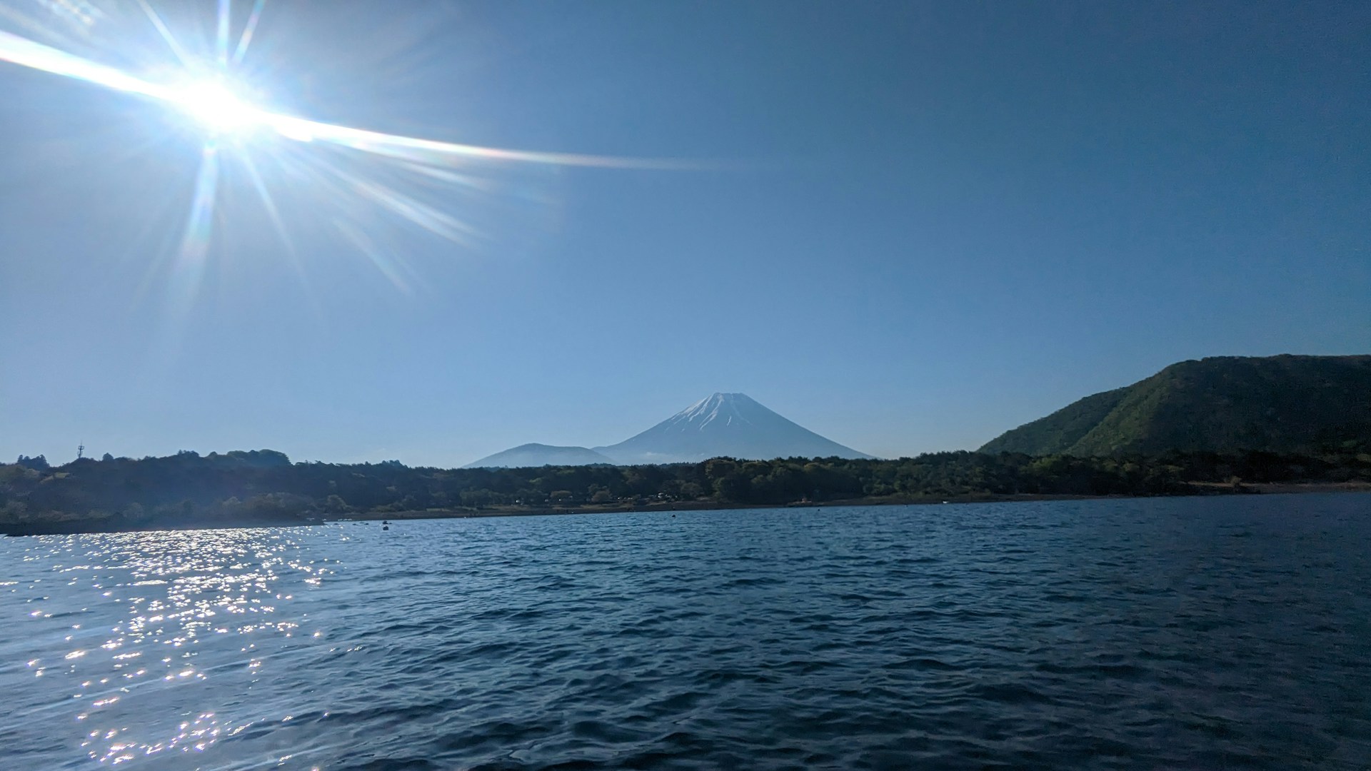A crisp, wide banner showing a sunrise over a calm lake, perfect for a newsletter header.