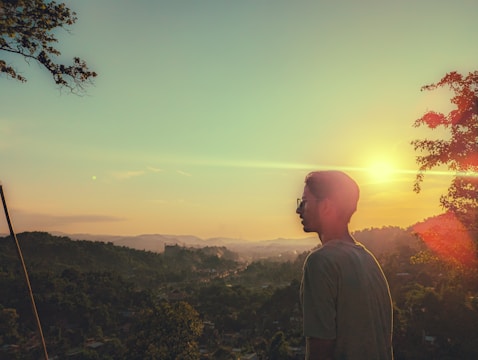 A serene landscape featuring a person in chic eyewear.