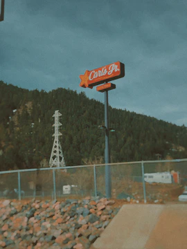 Still frame from the Paris Hilton x Carl's Jr. AI commercial showing a playful, retro-inspired scene.