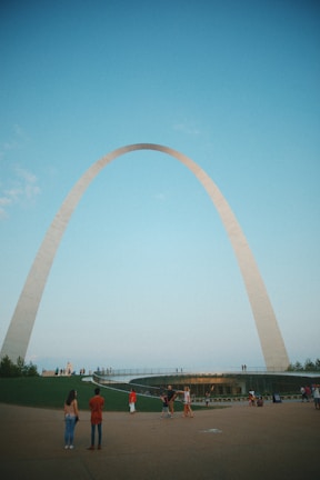 A visitor happily exploring a famous city landmark with a visa in hand.
